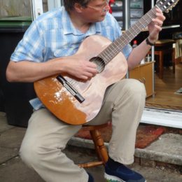 Alastair playing guitar